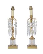 A PAIR OF GILT METAL AND CUT GLASS MOUNTED TABLE LUSTRES
