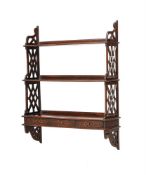 AN EDWARDIAN FLIGHT OF THREE MAHOGANY WALL SHELVESCIRCA 1905, AFTER THE MANNER OF THOMAS CHIPPENDALE