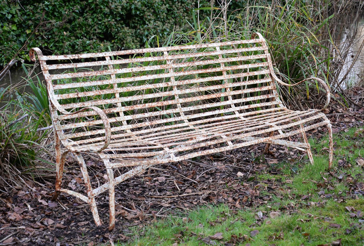 A REGENCY IRON STRAPWORK GARDEN BENCH