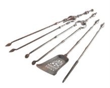 A SET OF THREE EARLY VICTORIAN STEEL FIRE TOOLS