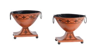 A PAIR OF PAINTED TINWARE CHESTNUT URNS IN REGENCY TASTE