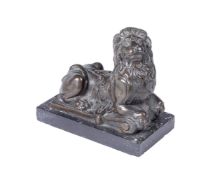 A CONTINENTAL BRONZE MODEL OF A RECUMBENT LION