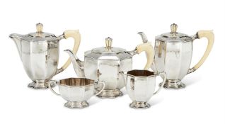 Y A CASED SILVER FIVE PIECE CIRCULAR FLUTED TEA AND COFFEE SET