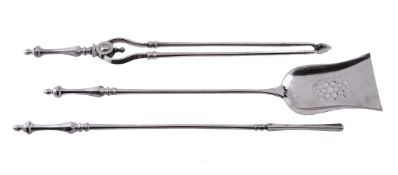 A SET OF THREE POLISHED STEEL FIRE TOOLS
