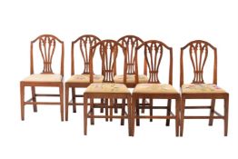 A SET OF SIX GEORGE III ELM DINING CHAIRS
