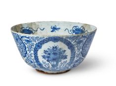 A BRISTOL DELFT BLUE AND WHITE DATED COMMEMORATIVE PUNCH BOWLDATED 1717Painted with panels of flow