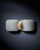 A Chinese mottled-white jade belt buckle