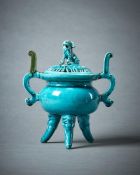 A Chinese turquoise glazed tripod censer and cover
