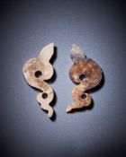 A pair of Chinese calcified jade bird-form pendants
