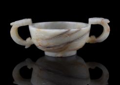 A Chinese white and russet jade archaistic cup