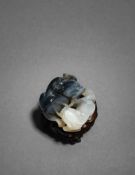 A black and white jade carving of a water buffalo and a qilin