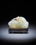 A Chinese pale celadon jade 'horse and monkey' carving