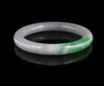 A Chinese green jadeite bangle