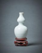 A Chinese small white glazed double-gourd porcelain vase
