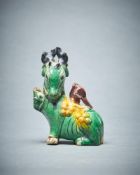 A Chinese small biscuit glazed model of a deer