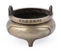 A Chinese bronze tripod censer