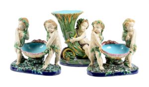 A PAIR OF MINTON MAJOLICA FIGURAL TABLE CENTREPIECES