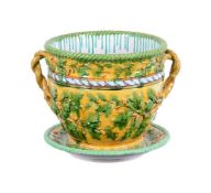 A LARGE MINTON MAJOLICA TWO HANDLED JARDINIERE AND STAND
