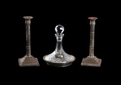 A PAIR OF ELECTRO-PLATED CANDLESTICKS