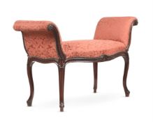 A MAHOGANY AND UPHOLSTERED WINDOW SEAT IN GEORGE III STYLE