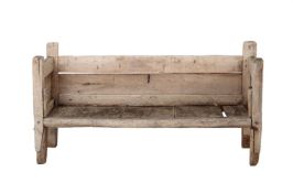 A HARDWOOD RUSTIC GARDEN BENCH
