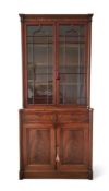 A GEORGE IV MAHOGANY BOOKCASE, IN THE MANNER OF GILLOWS, CIRCA 1825