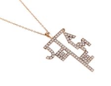 A DIAMOND SET JE T'AIME PENDANT, LONDON 1977