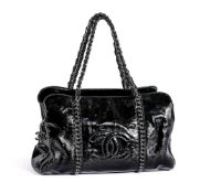 CHANEL, A LARGE BLACK PATENT LEATHER LIGNE