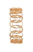 A GOLD COLOURED HOOPED BRACELET