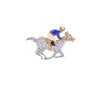A DIAMOND HORSE AND JOCKEY BROOCH