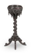 Y A CEYLONESE CARVED SOLID EBONY JARDINIERE STAND, IN THE MANNER OF THOMAS KING, MID 19TH CENTURY