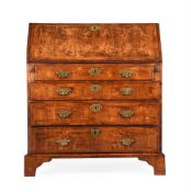 A GEORGE II WALNUT BUREAU, CIRCA 1735