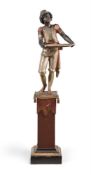 AN ITALIAN GILTWOOD, EBONISED AND POLYCHROME DECORATED 'BLACKAMOOR' FIGURE ON STAND