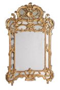 A LOUIS XV CARVED GILTWOOD MIRROR, CIRCA 1755