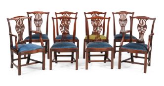 A SET OF EIGHT GEORGE III MAHOGANY DINING CHAIRS, IN THE MANNER OF THOMAS CHIPPENDALE