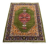 A TABRIZ CARPET, SIGNED BY MASTER WEAVER JAVADZAHED, approximately 286 x 196cm