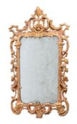 A GEORGE III CARVED GILTWOOD WALL MIRROR, PROBABLY IRISH, CIRCA 1760