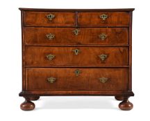 A WALNUT AND FEATHER BANDED CHEST OF DRAWERS, CIRCA 1710 AND LATER