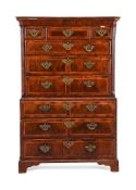 A GEORGE II FIGURED WALNUT AND FEATHER BANDED CHEST ON CHEST, CIRCA 1740