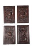 A SET OF FOUR CARVED OAK 'ROMAYNE' PANELS, 16TH CENTURY
