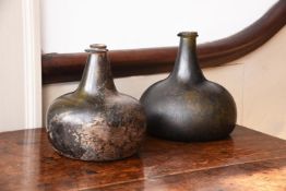 TWO OLIVE-GREEN TINT WINE BOTTLES, ENGLISH, EARLY 18TH CENTURY