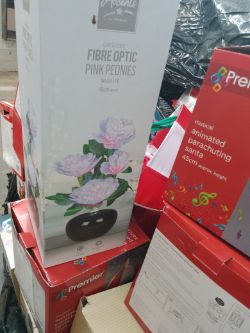 1 Pallet of Parachuting Santa's, display village & fibre optic flowers