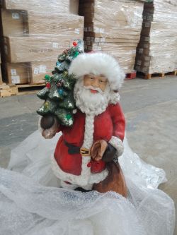 1 Pallet of returned Christmas products, including Approx 8 Christmas trees, Santa and a wreath