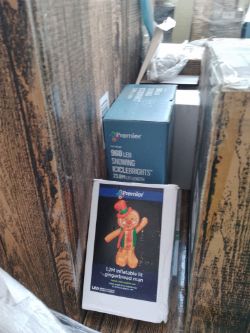 1 Pallet of Approx 8 LARGE Returned Christmas trees various sizes, Tree lights and a gingerbread man