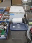 A Hotpoint Under Counter Freezer and a bin of stainless steel cooking items