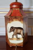 A contemporary hexagonal shaped painted metal lamp base in tones of terracotta & gold with two sides