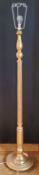 A Regency style gilded standard lamp, with a slender fluted column on a stepped and weighted base