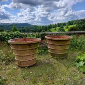 An impressive pair of substantial terracotta country house estate planters 53cms high x 67.5cms dia.