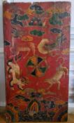 Himalayan Art - A 19th century Tibetan temple door panel, vibrantly hand painted with a central