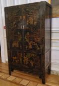 An 18th century style Chinese black lacquered marriage chest, decorated with pseudo-Oriental